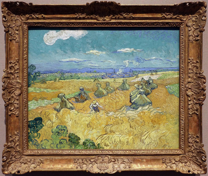 Champ de blé avec gerbes et moissonneuse - Vincent van Gogh