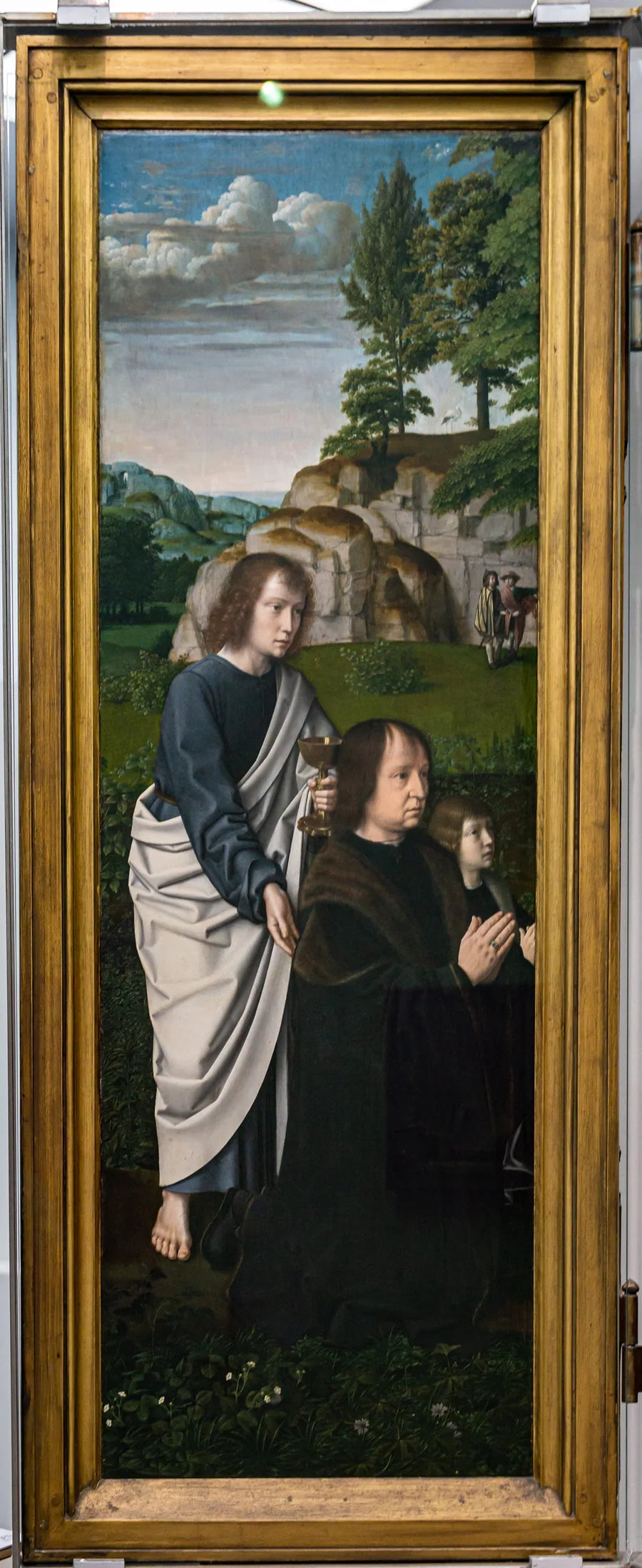 De H. Johannes de Evangelist met  Jan de Trompes en zijn zoon - Gérard David