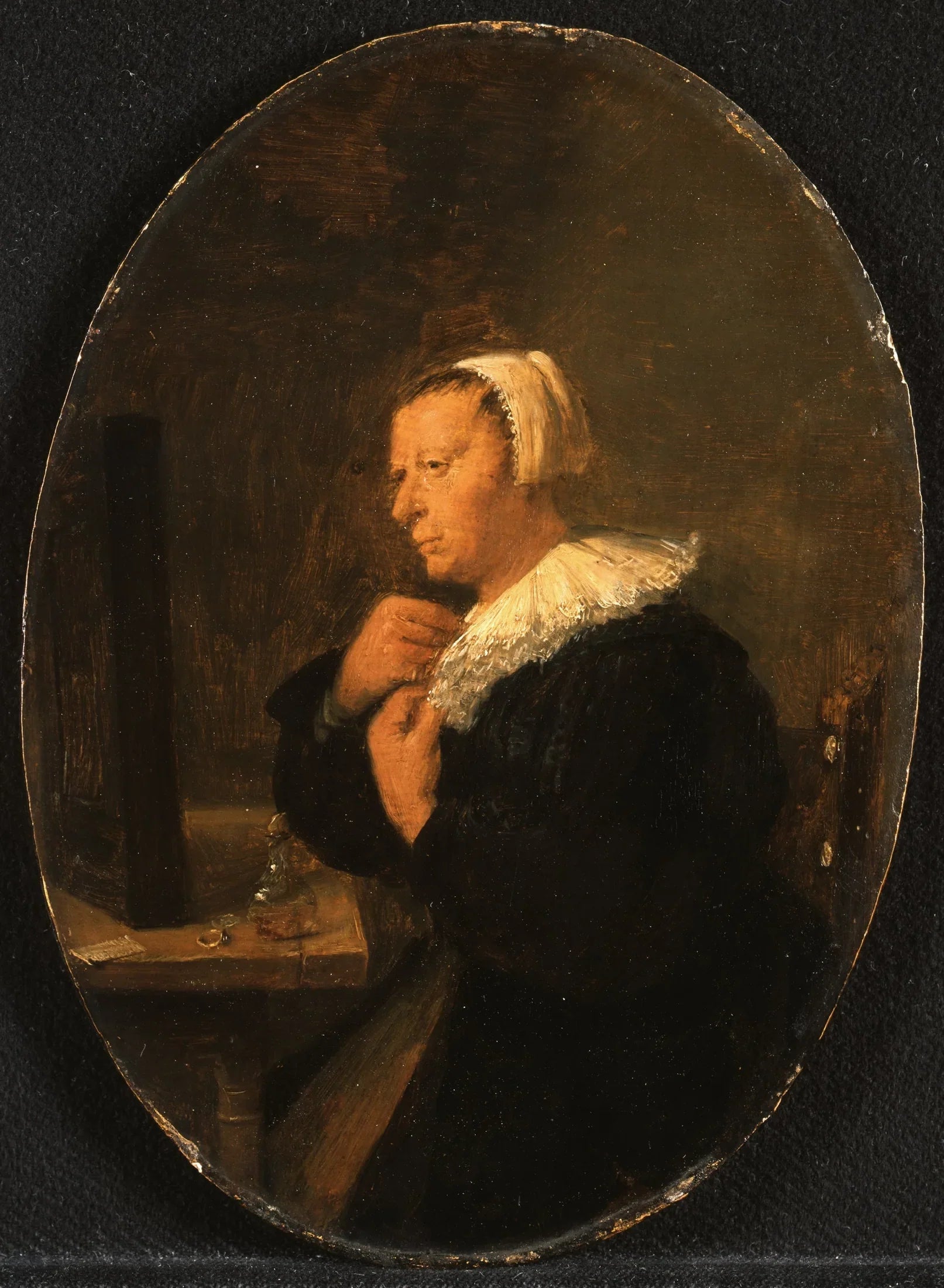 Femme assise à une table devant un miroir (se préparant) - Adriaen Brouwer image 1 reproduction artisanale de tableau
