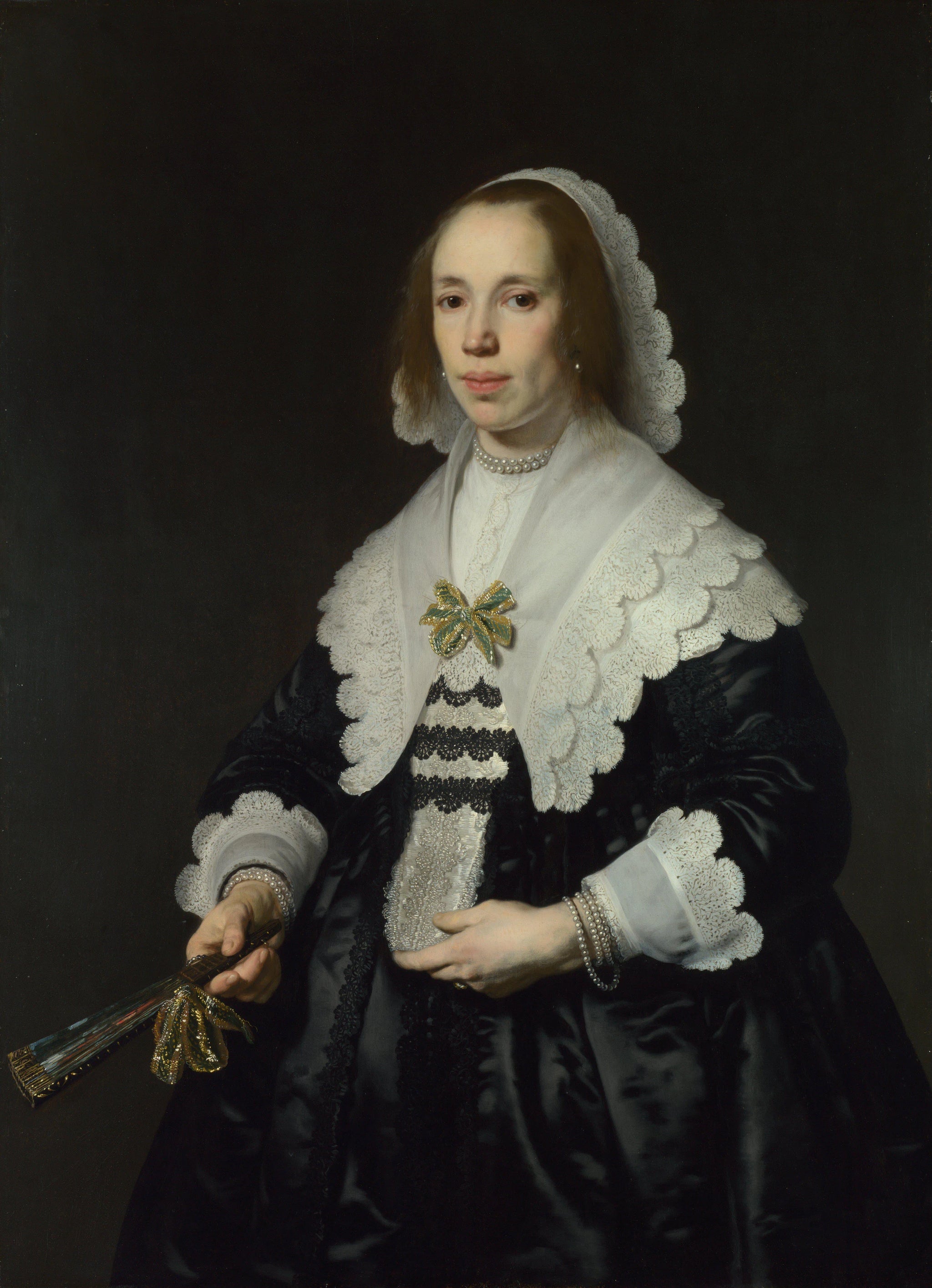 Portrait de dame en satin noir à l'éventail - Bartholomeus van der Helst