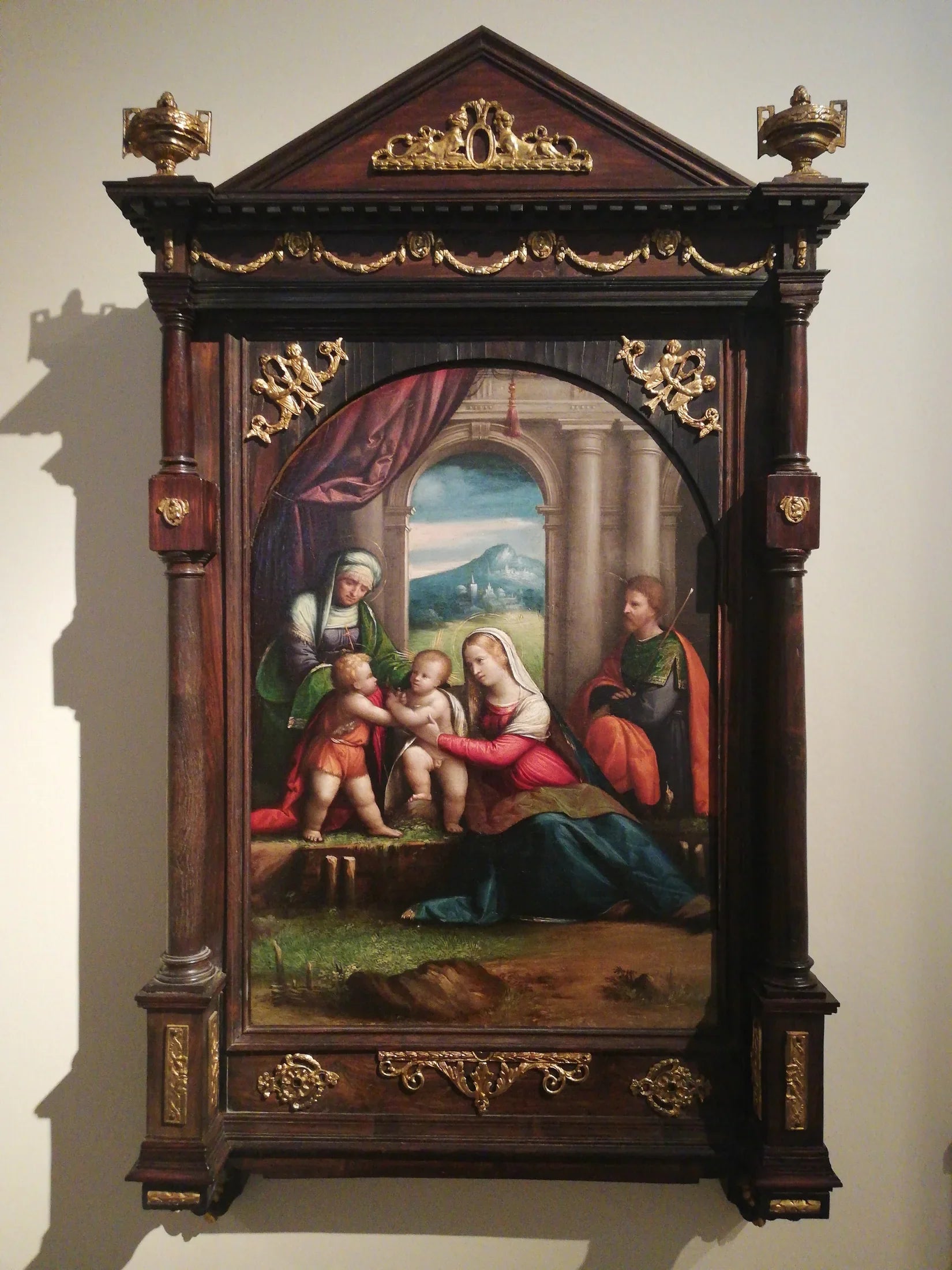 Sacra Famiglia con i santi Giovanni ed Elisabetta - Benvenuto Tisi image 1 tableau peint à l’huile sur toile