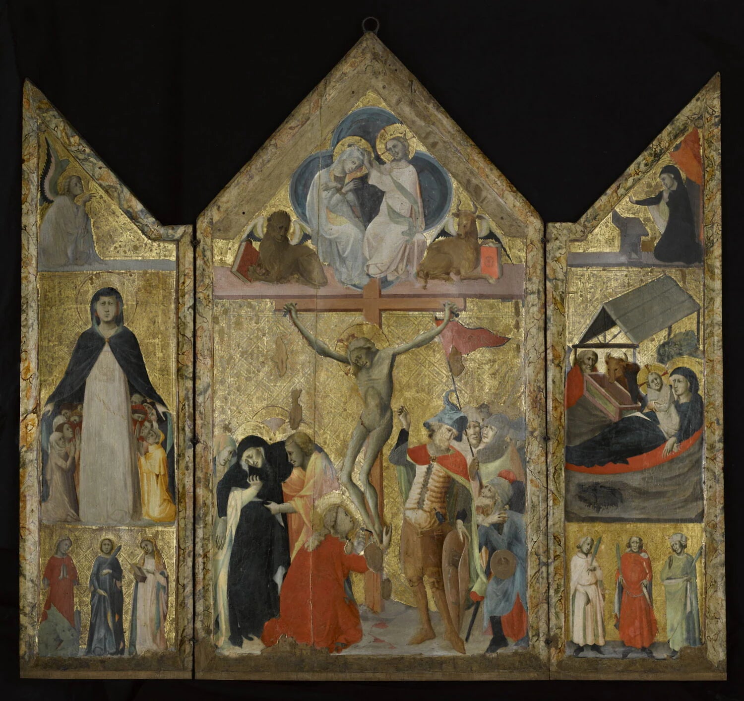 Triptyque à volets mobiles : Panneau central : La Crucifixion ; dans le gâble, Le Couronnement de la Vierge ; Volet gauche : de haut en bas, l'Ange de l'Annonciation ; La Vierge de Miséricorde ; Sainte Marguerite, sainte Catherine et... - Maître de 1333